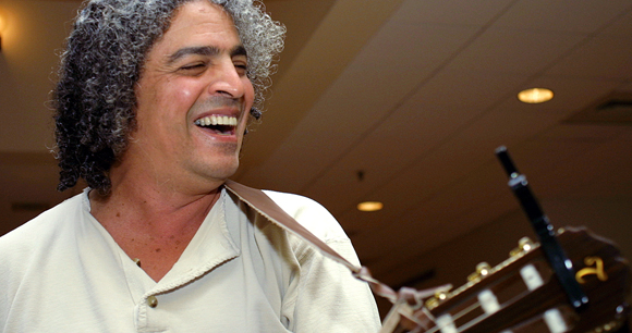 smiling tibi with guitar